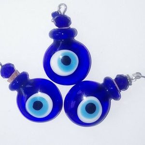 Evil eye bottle essential oils fragrance or ashes